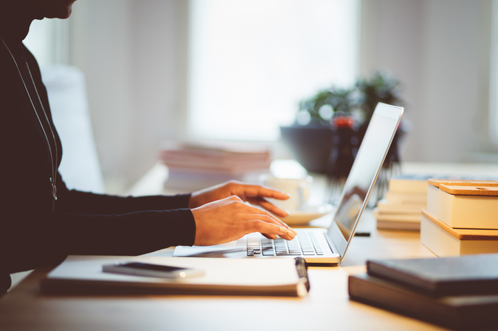 Elegance woman using laptop in an office or at home