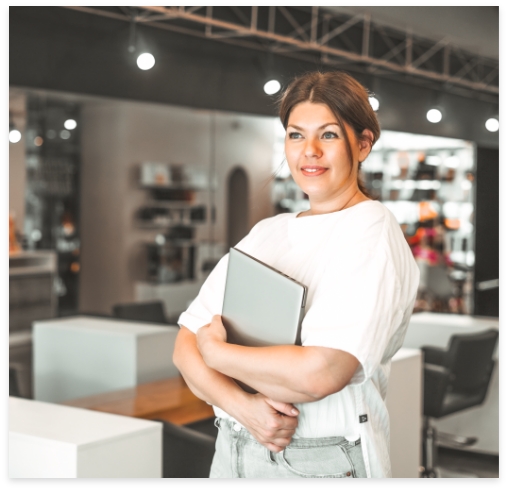 beautiful-stylish-young-woman-plus-size-body-positive-with-laptop-at-beauty-salon-office-small_t20_gz9ykk